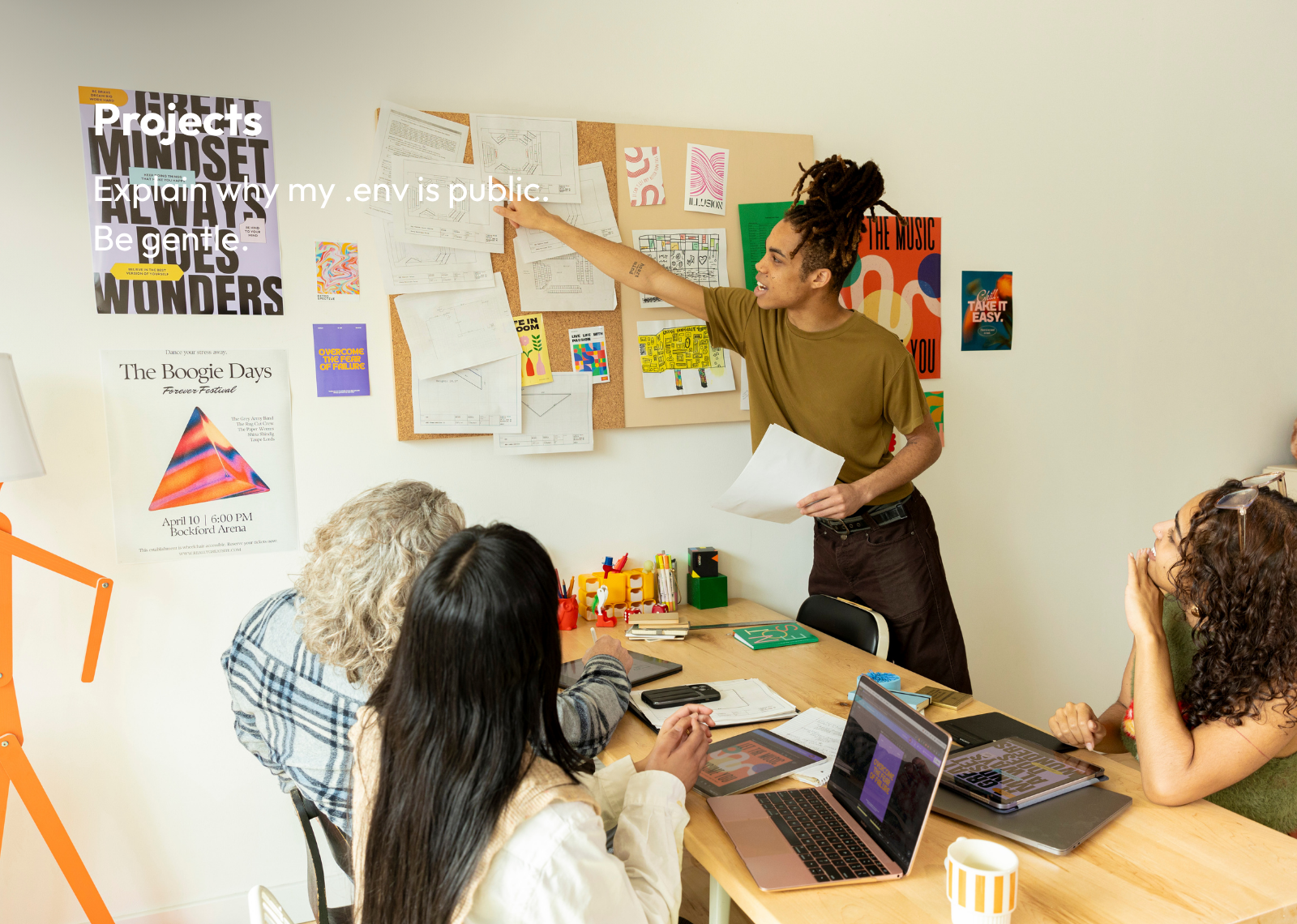 Finkkle Igno Projects feature showing a team reviewing project plans around a table.